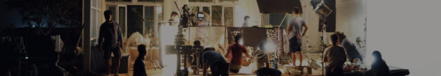 Production crew setting up a scene at a filming set