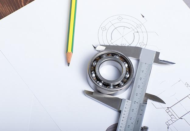 aliper holding a bearing on a technical drawing