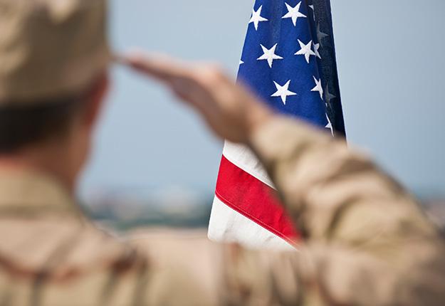 Soldier saluting the American flag