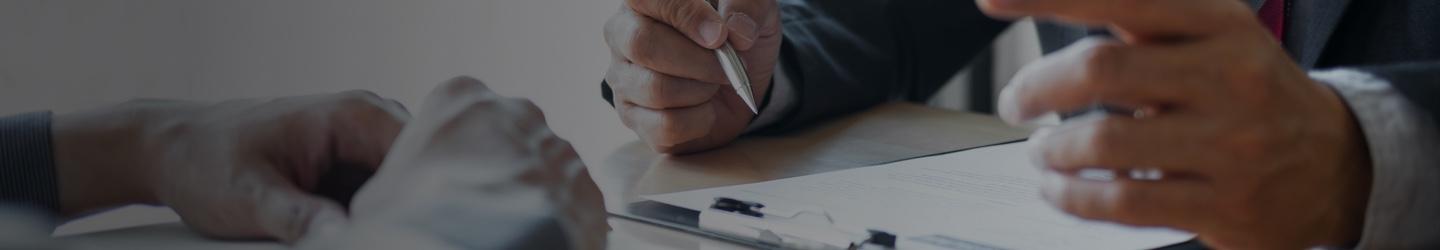 Hands of two businessmen having a interview at a table