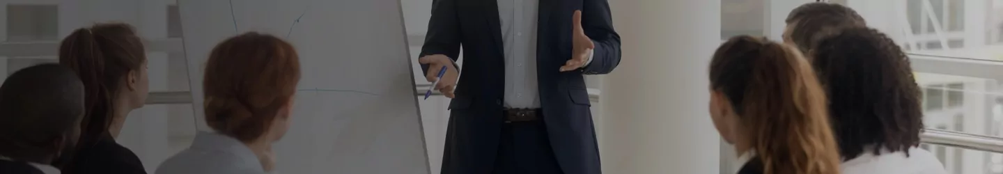 Businessman having a meeting with two businesswomen in a conference room