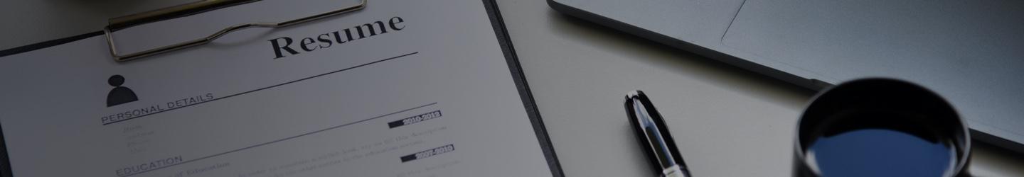 A resume clipped on a clippboard