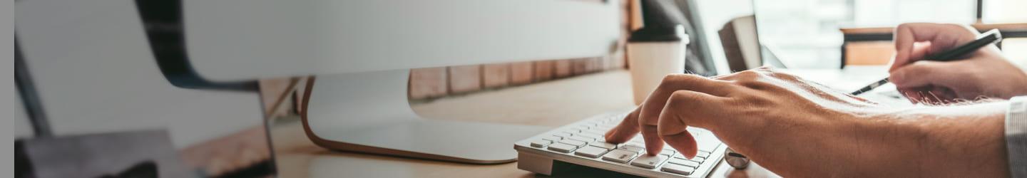 Fingers typing on a computer keyboard