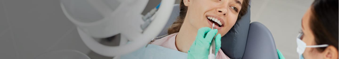 Dentist cleaning a patient's teeth