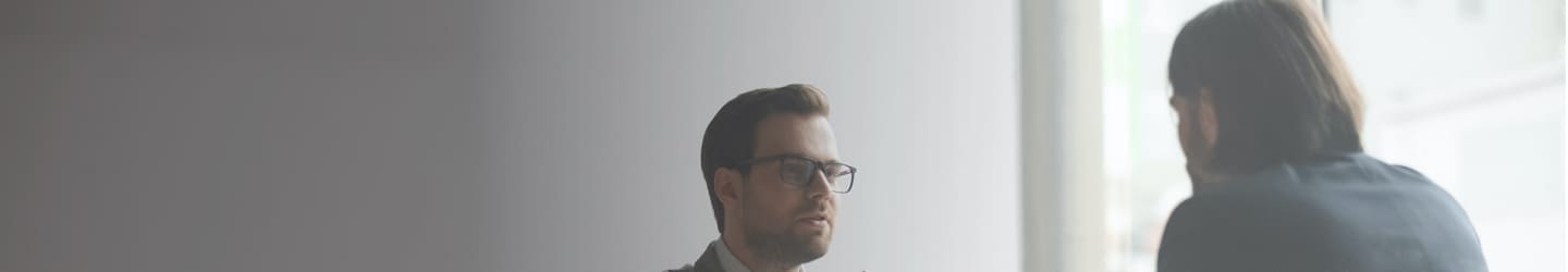 Two bisnessmen discussing in a conference room