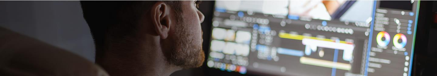 Man editing a video on a computer