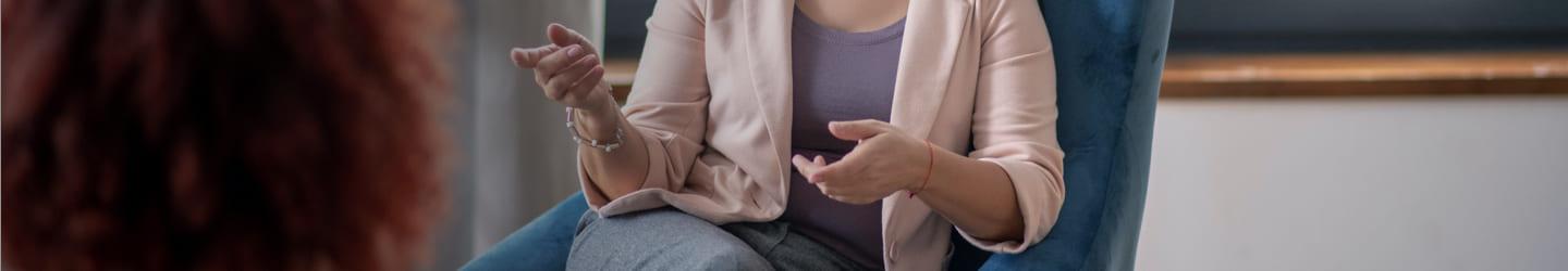 Psychologist talking to a patient