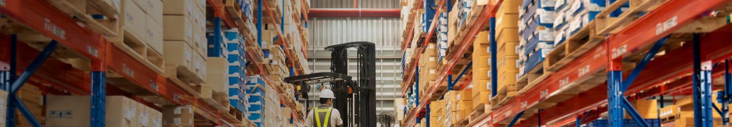Man opperating a forklift in a warehouse