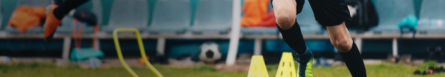 Soccer player practicing in the field