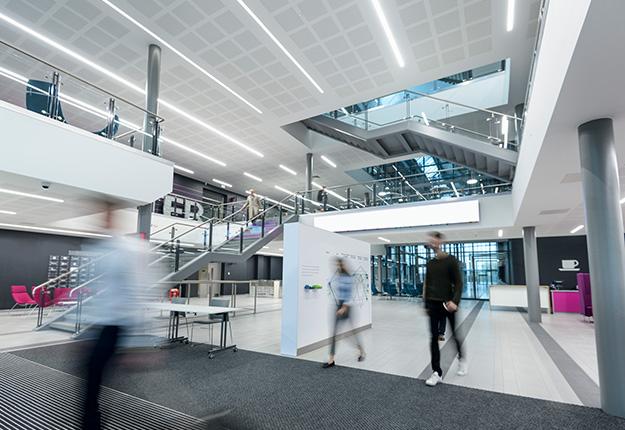 Apprentices walking in company office