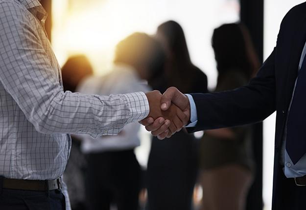Two business men shaking hands