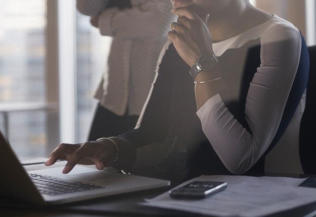 Woman reading from laptop