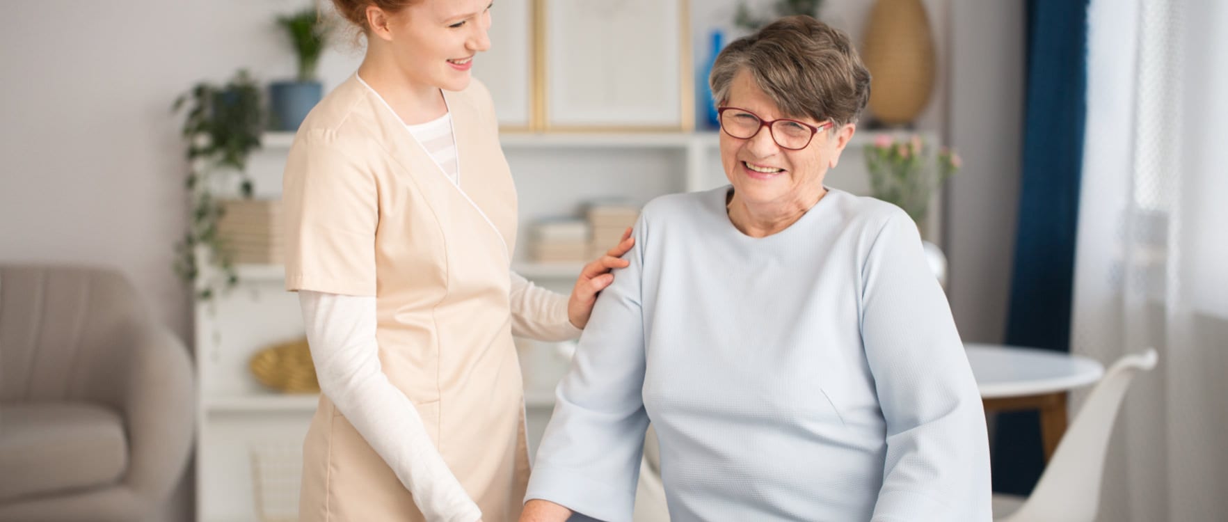 Female nurse taking care of an elderly woman