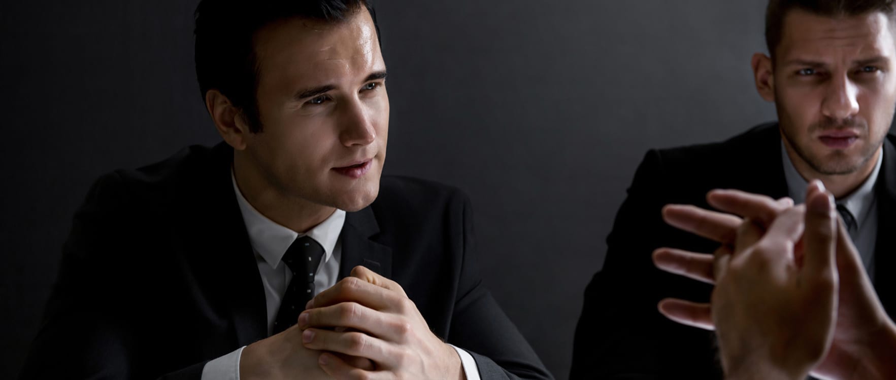 Men in suits talking seriously