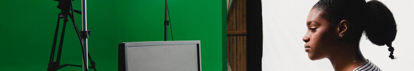 Lighting designer reviewing on a computer screen in a studio