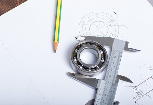 aliper holding a bearing on a technical drawing