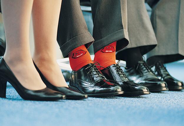 Businessman standing out wearing colorful sox