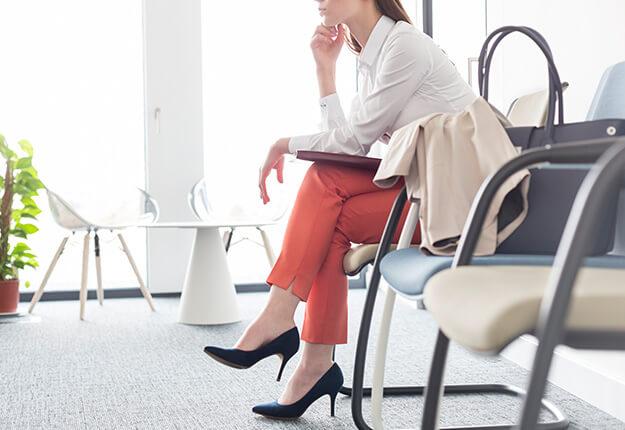 Businesswoman waiting in lobby sitting down