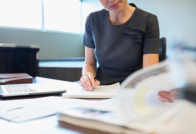 Woman attorney reading papers
