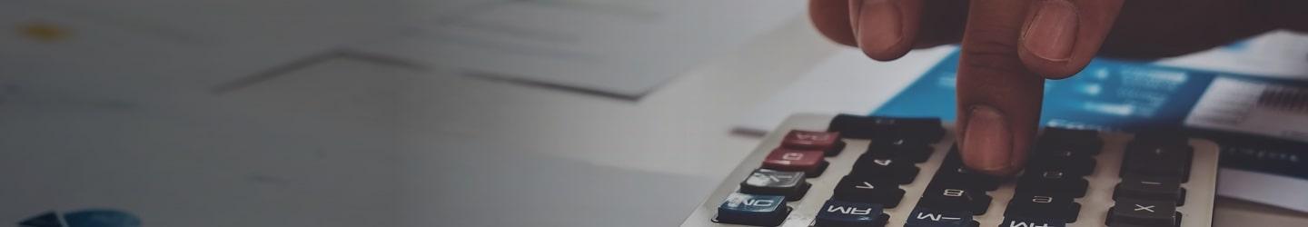 accountant typing on calculator