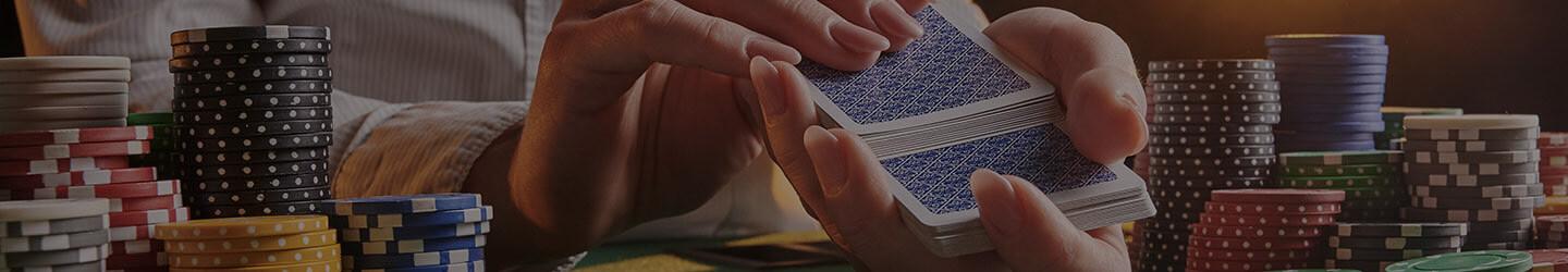 Poker dealer shuffling cards at a casino