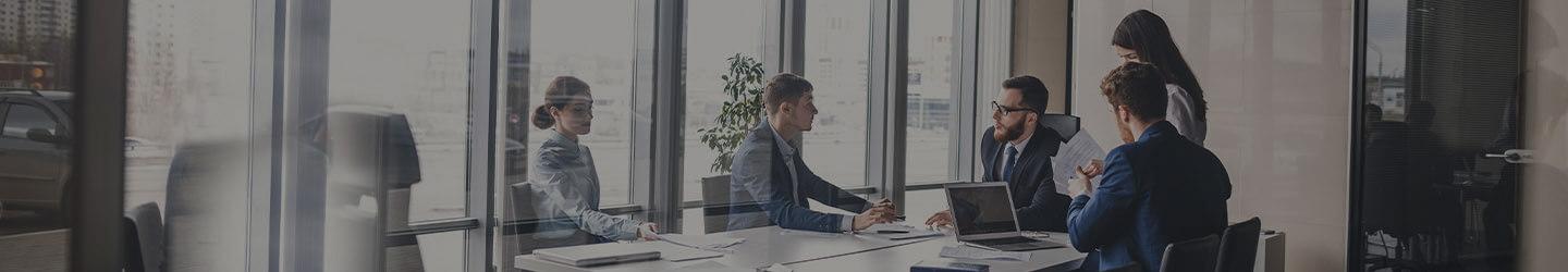 Team or businessmen and women discussing at a conference room