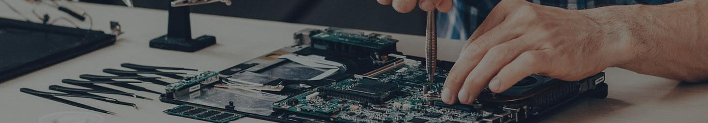 Technician working on a motherboard