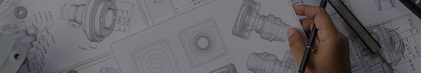 Engineer's hand holding blueprints of mechanical pieces